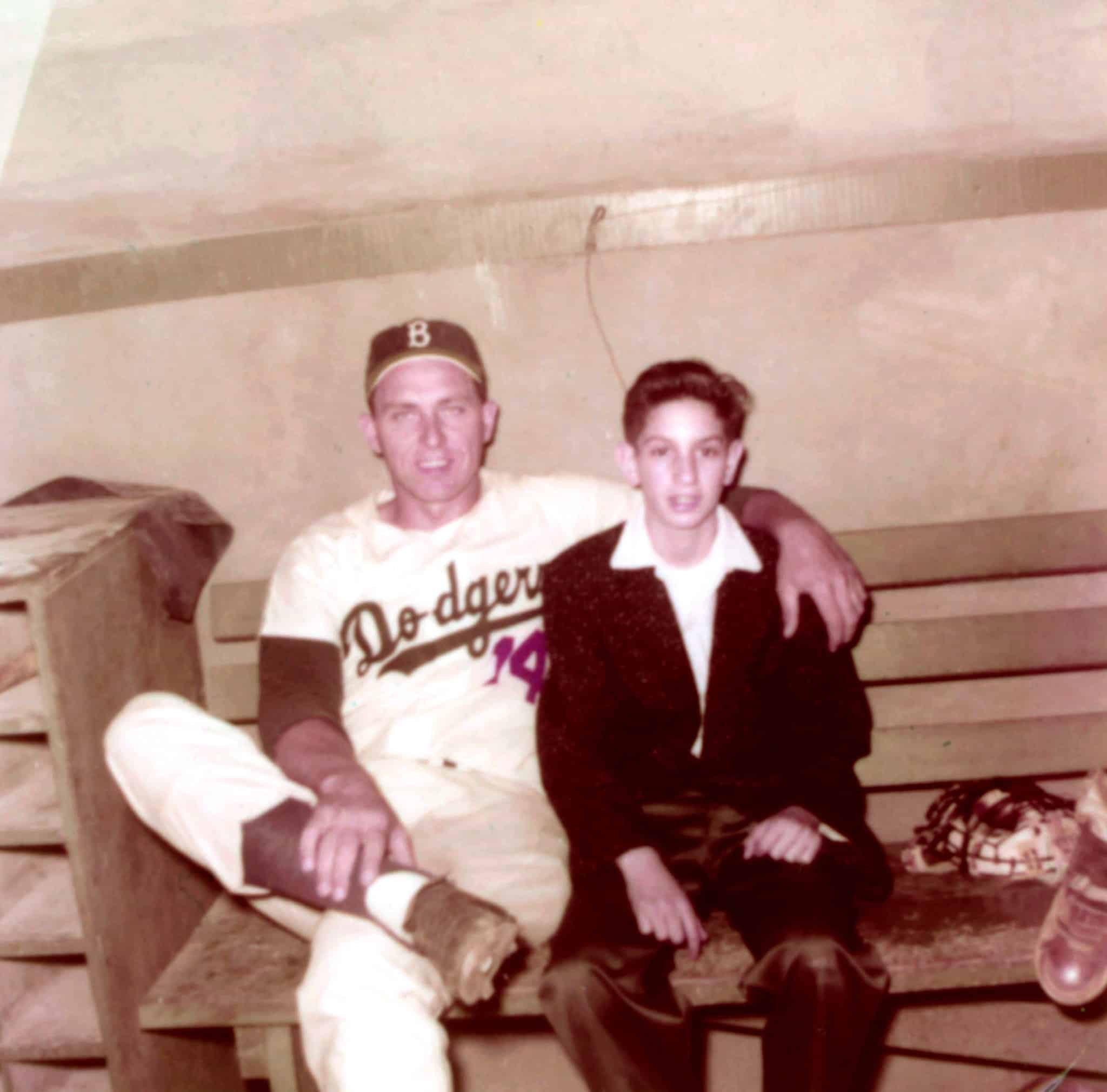 In 1957, Albert, pictured with Gil Hodges, was a 16-year-old office boy for the Dodgers.Credit...Courtesy of Marv Albert