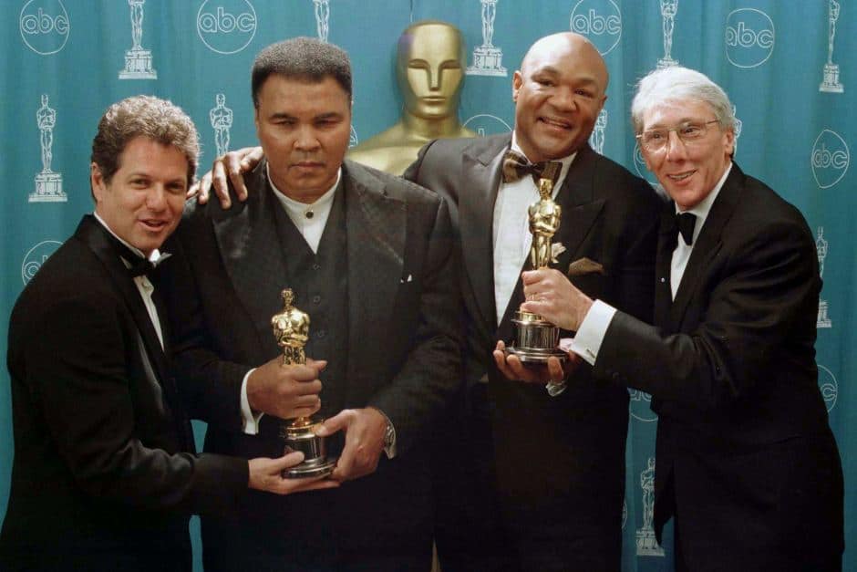 George Foreman and Muhammad Ali with Oscars