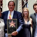 Chris Berman with his wife and children