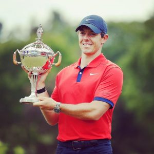 Rory Mcilroy holding a trophy