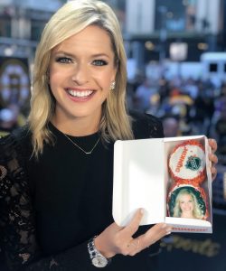 Kathryn Tappen showing customized donuts from Dunkins