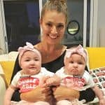 Amanda Balionis while holding her friends babies