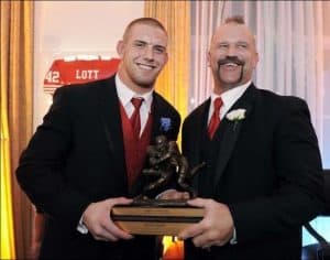 James Laurinaitis shows his Lott trophy with his father.