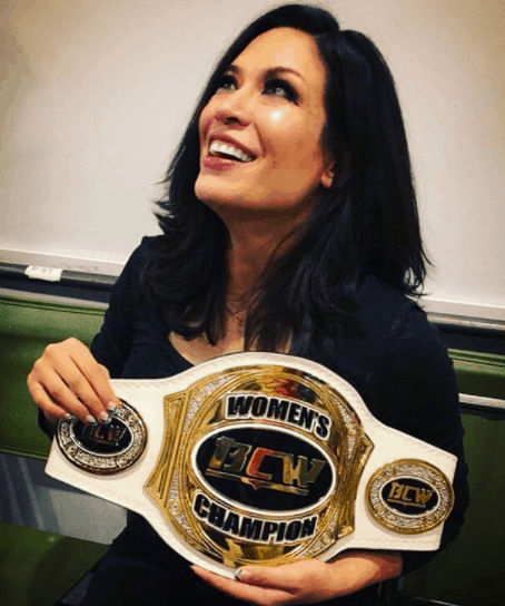 Melina with her Championship belt