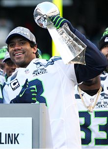 Russell Wilson with his precious award