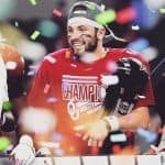 Baker holding his trophy after winning championship
