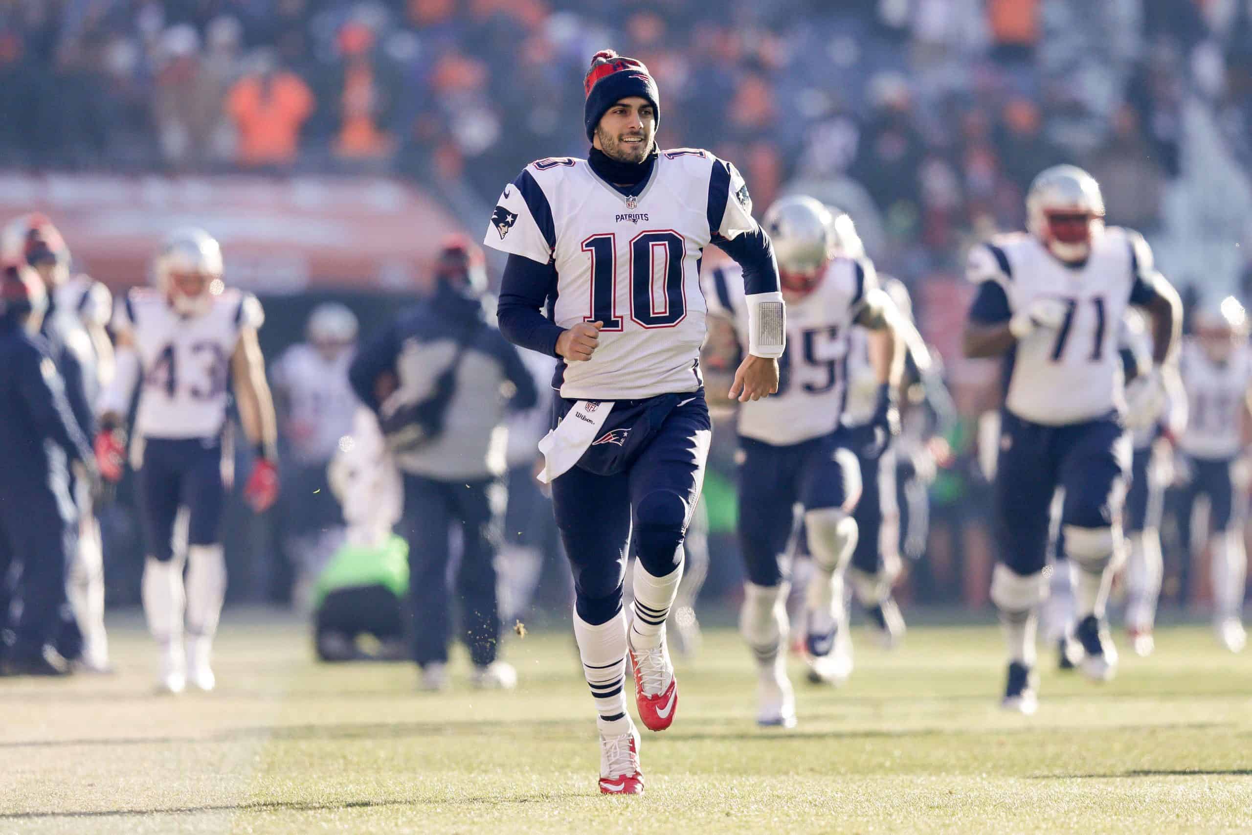 Dec 18, 2016; Denver, CO, USA; New England Patriots quarterback Jimmy Garoppolo (10) runs onto the field before the game at Sports Authority Field at Mile High. Mandatory Credit: Isaiah J. Downing-USA TODAY Sports