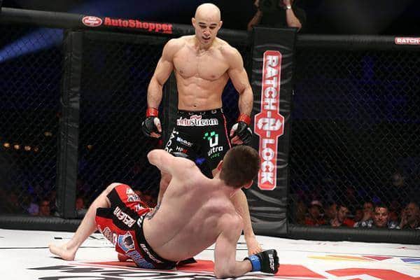 two-fighter-MMA-octagon-red-black-Moraes