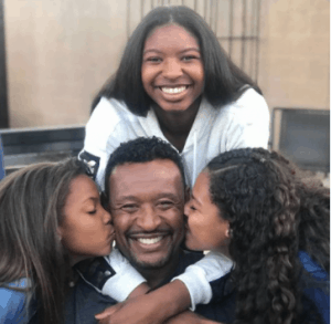 Willie McGinest with his daughters