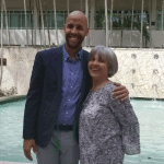With his mother