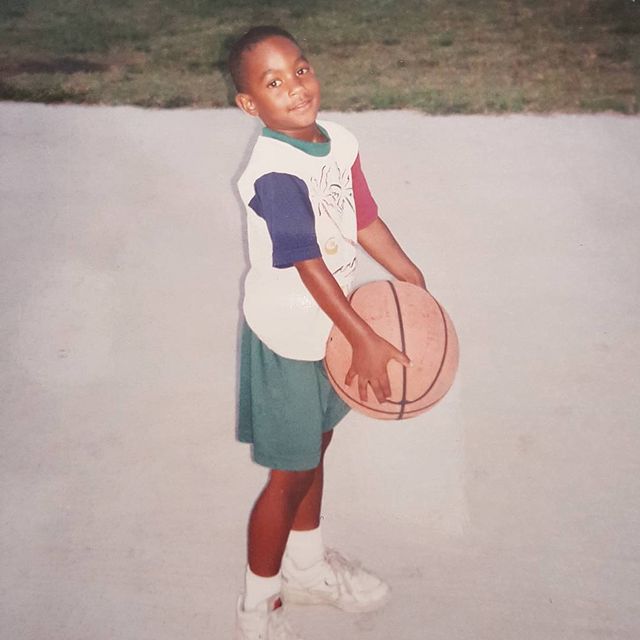 Young Brian holding a basketball