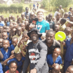 Terence helping childrens