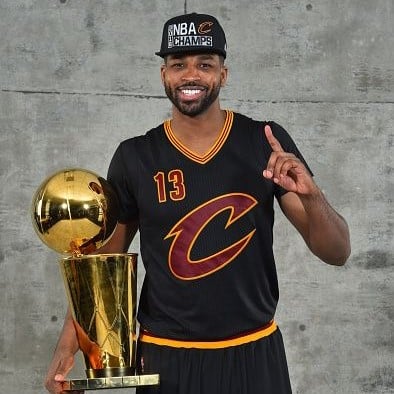 Tristan Thompson With The NBA Trophy
