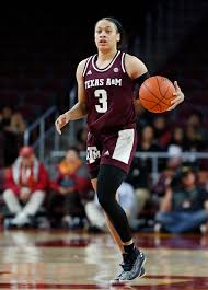 Chennedy Carter with basketball while playing for Texas A&M
