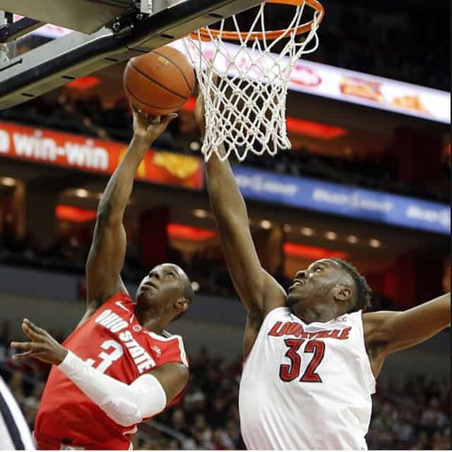 Onuaku (white) blocking the shot