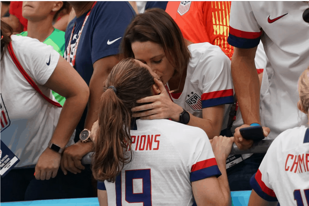 Kelley kissing her girlfriend at the FIFA World Cup 2019