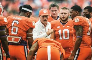 Brent Venables With His Team