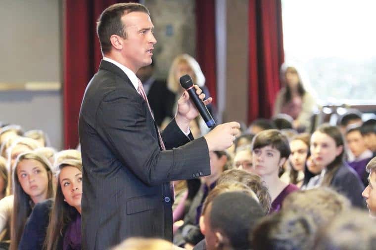 Chris Herren presenting in event.