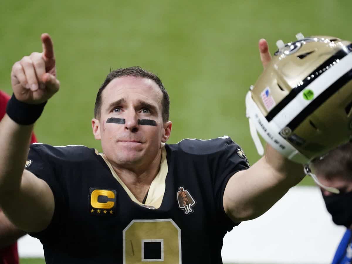 New Orleans Saints quarterback Drew Brees waves to his family and fans after his final NFL game, a playoff loss to the Buccaneers