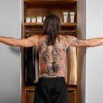 Zlatan showing off his back tattoo