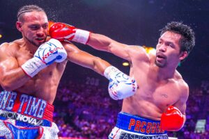 Pacquiao, hitting his opponent in the face.