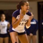Mariah Riddlesprigger playing volleyball in her college years
