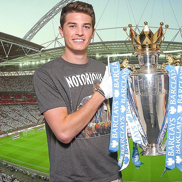 Max Fried holding premier league trophy