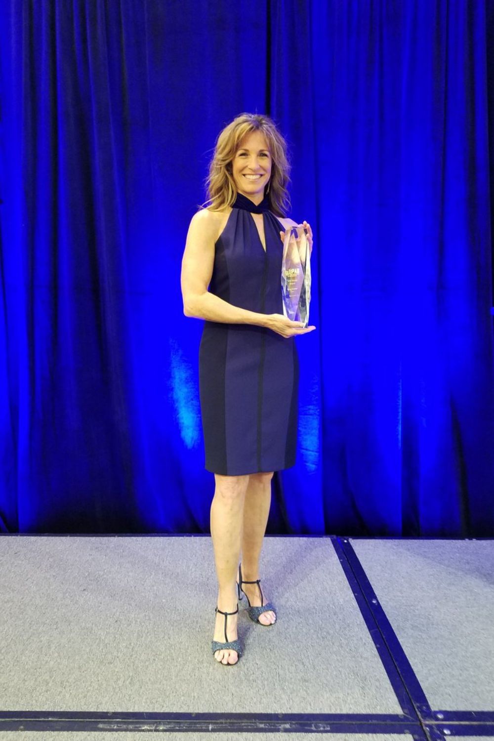 Suzy Kolber Holding An Award 