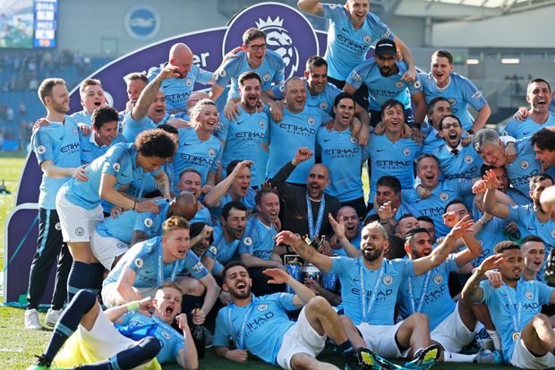 Team Manchester City celebrating the Premier League title win (Source: The Wall Street Journal)