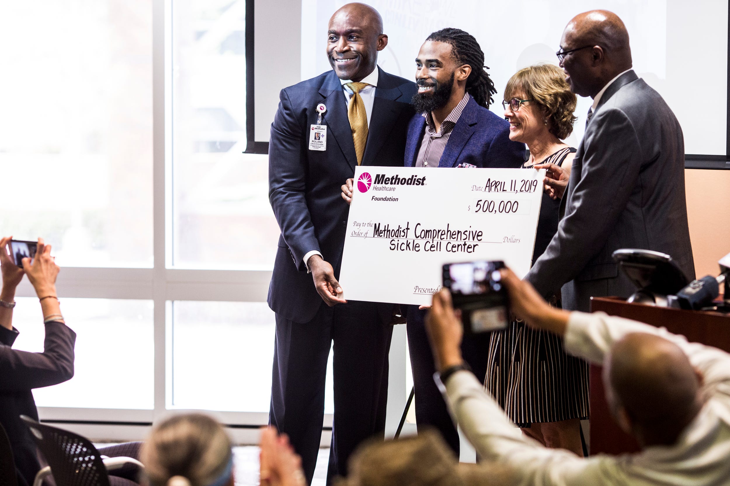 Mike Conley donating Methodist sickle cell center