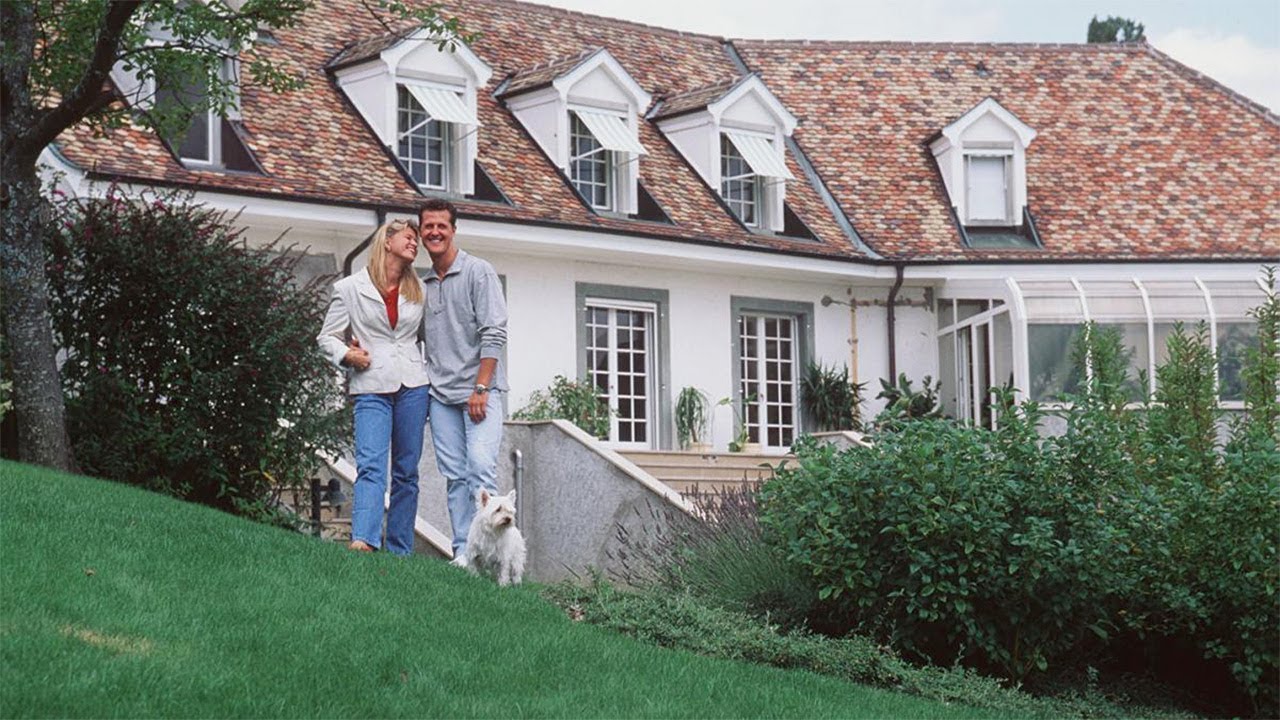 Michael Schumacher with his wife in front of his estate.