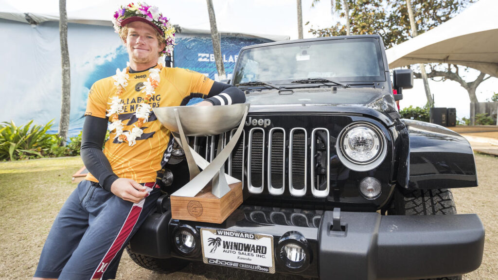 John John Florence is posing with his trophy