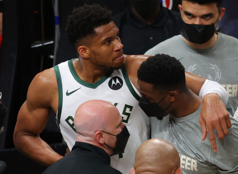 Giannis helped by his brother after injury