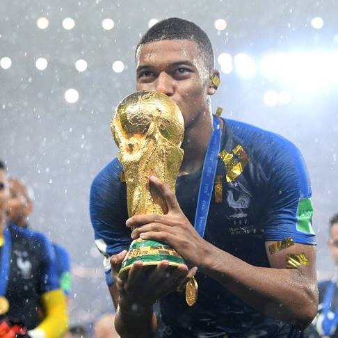 Mbappe kisses World Cup trophy