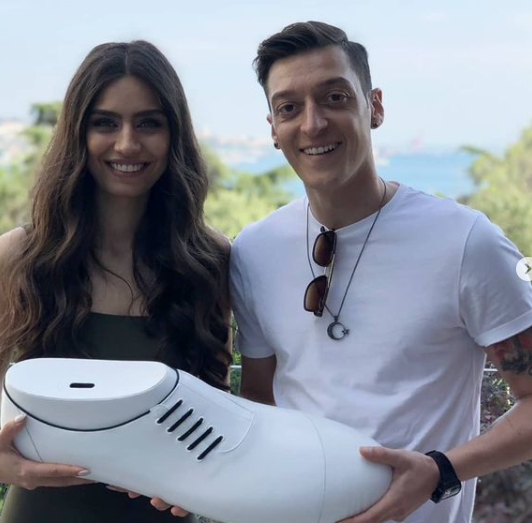Mesut with his wife, Amine working for the Big Shoe Project