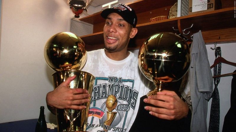 Tim Duncan after winning 1999 NBA championhip and NBA Finals MVP trophy