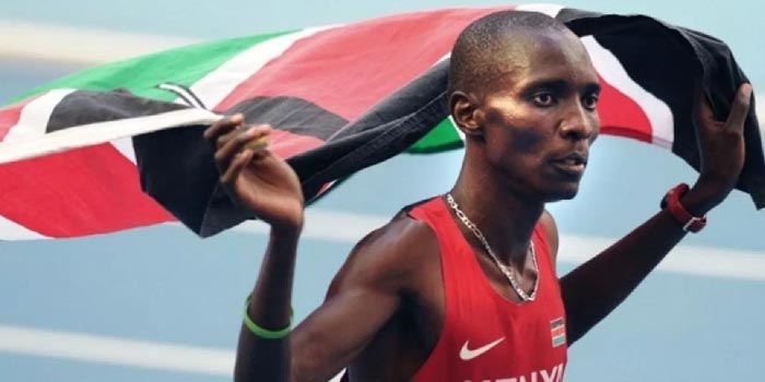 Asbel Kiprop Holding a Kenyan Flag