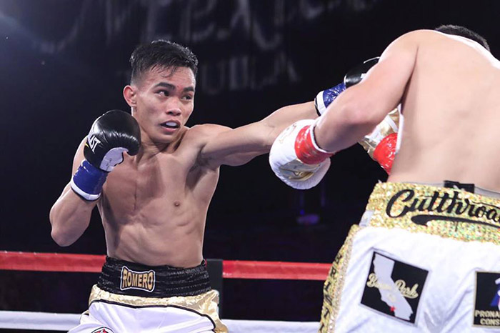 Romero Duno is showing his boxing skills inside the boxing ring.