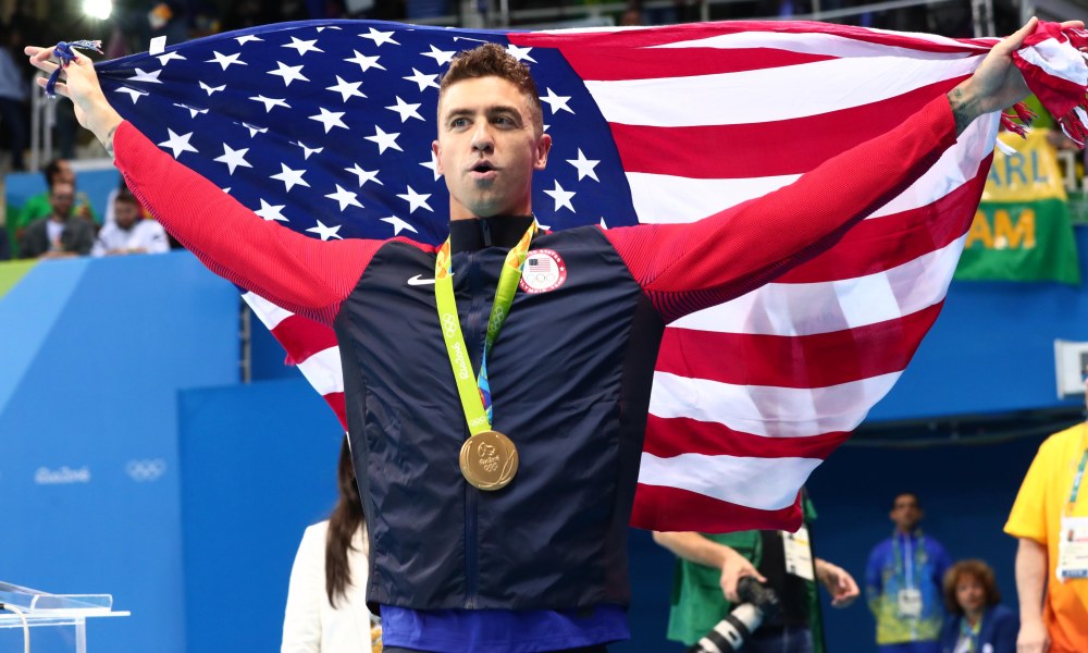 Anthony Ervin waving USA flag after winning 50m freestyle gold medal
