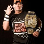 John Cena with his spinner WWE Belt