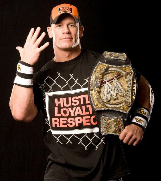 John Cena with his spinner WWE Belt (Source: Pinterest)