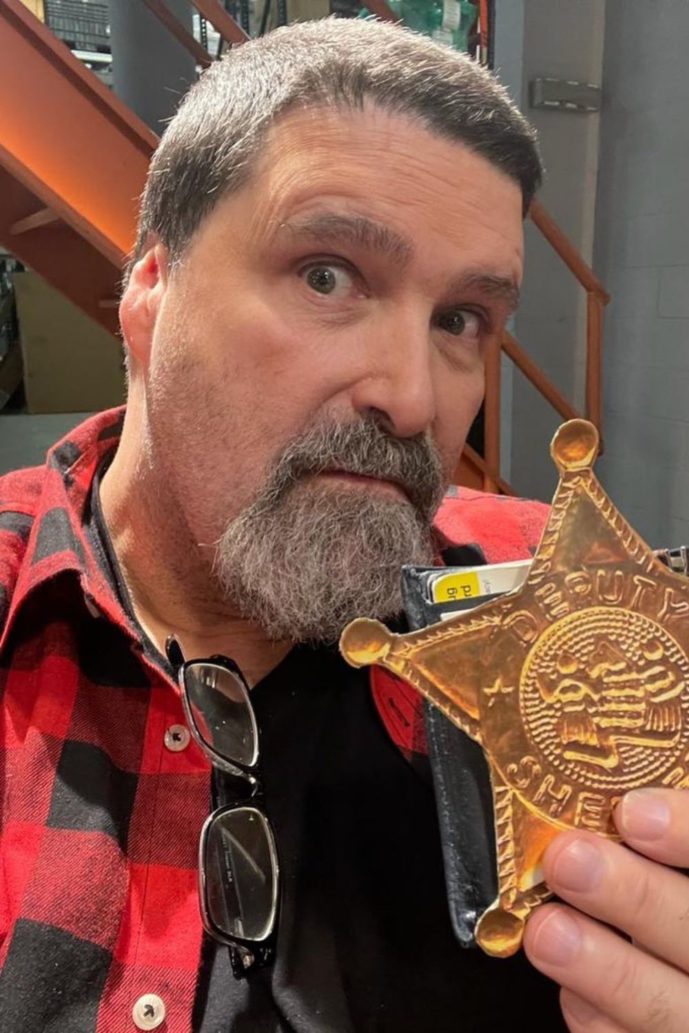 Mick Foley Showing Off his Badge For The New Assignment 