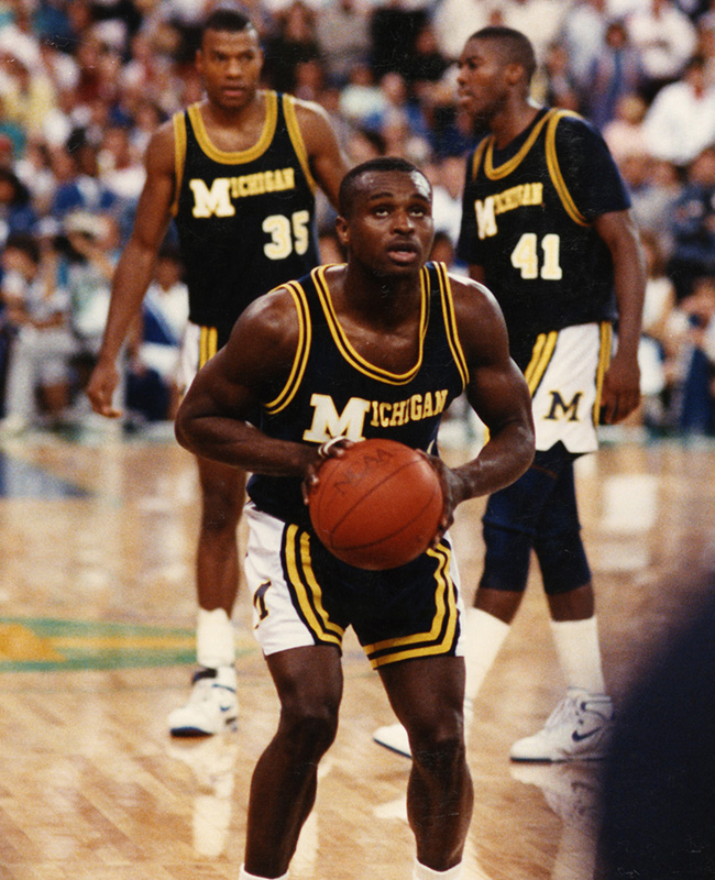 Rumeal Robinson playing At University of Michigan