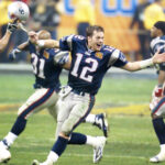 Tom Brady celebrates with his teammates after winning Super Bowl