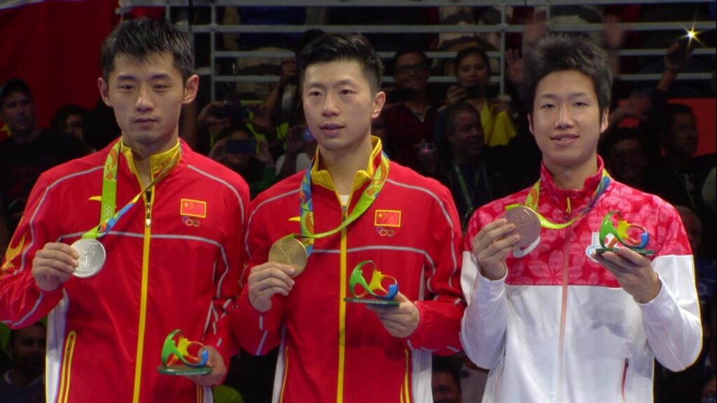 Ma Long with his fellow Chinese player after their victory in the 2016 Rio Olympics.