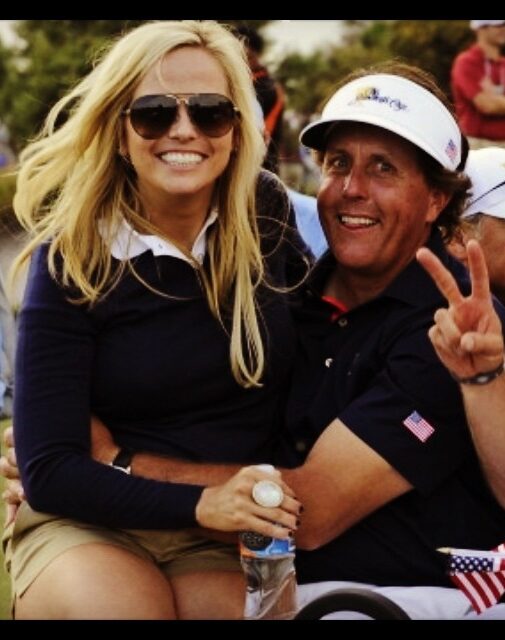 Amy Mickelson in her husband's lap