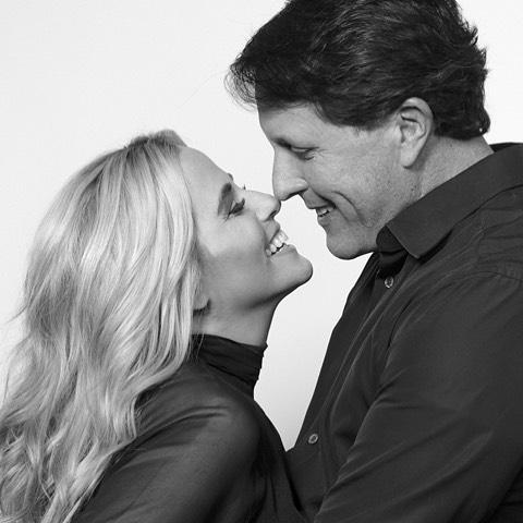 Amy Mickelson with her husband in a professional photoshoot