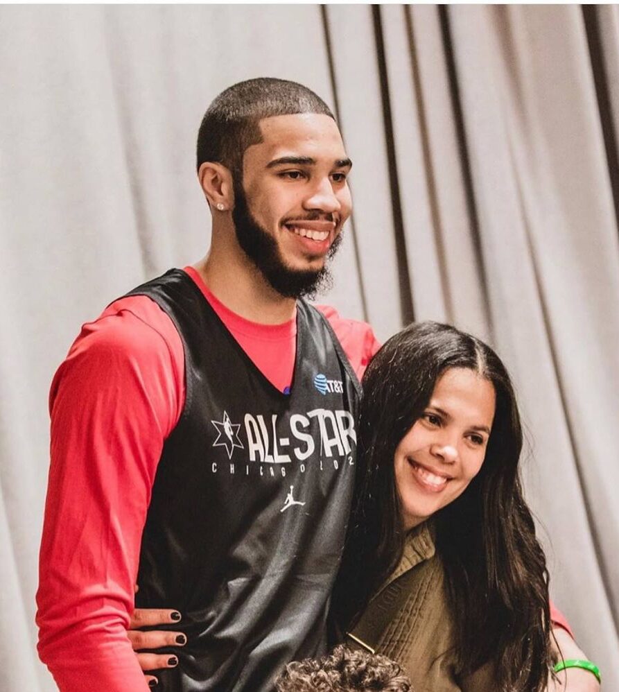 Brandy Cole, Jayson Tatum and his son smiling for the camera