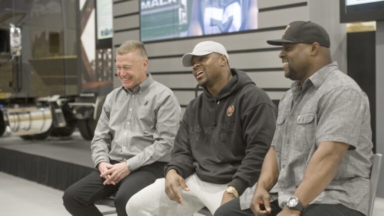 Khalil mack with his dad at Mack trucks