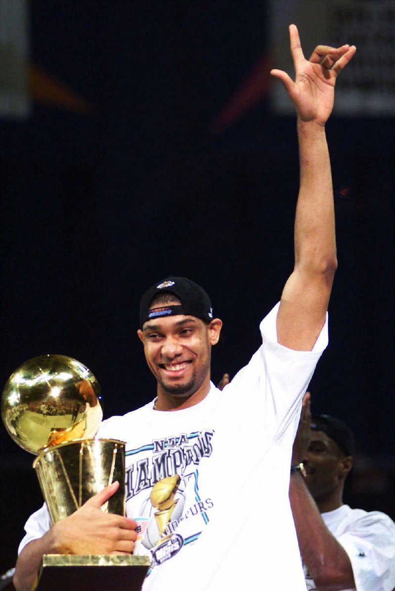 Tim Duncan With His 1999 NBA Final MVP Trophy
